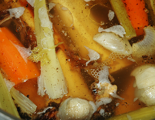 close up of simmering beef broth